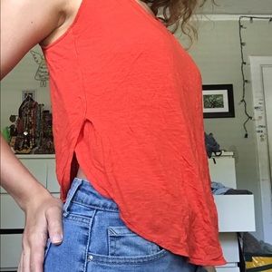 Bright orange/red sleeveless top